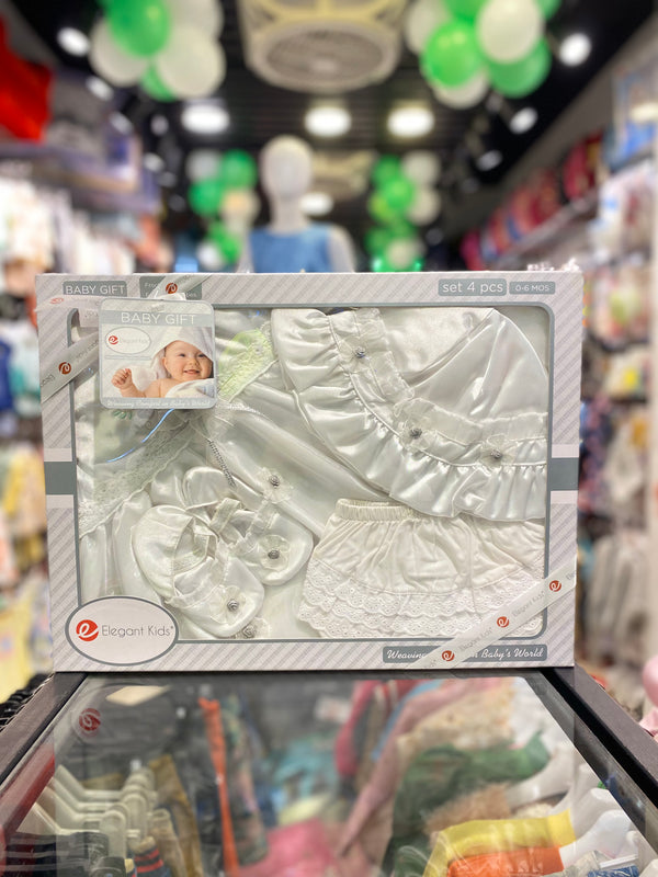 Baby outfit set in packaging with a store background